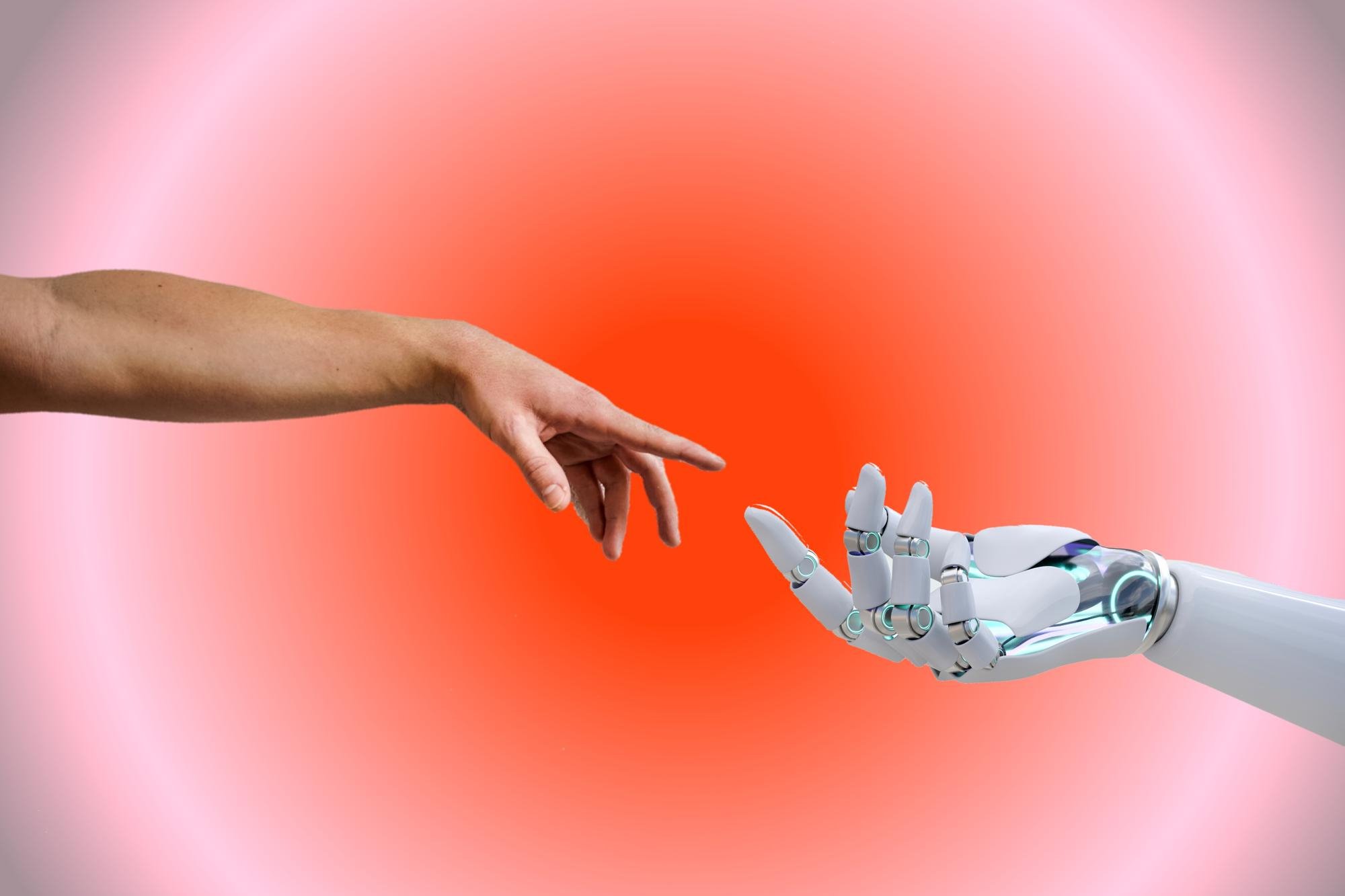 A hand reaching out to touch a human hand.
